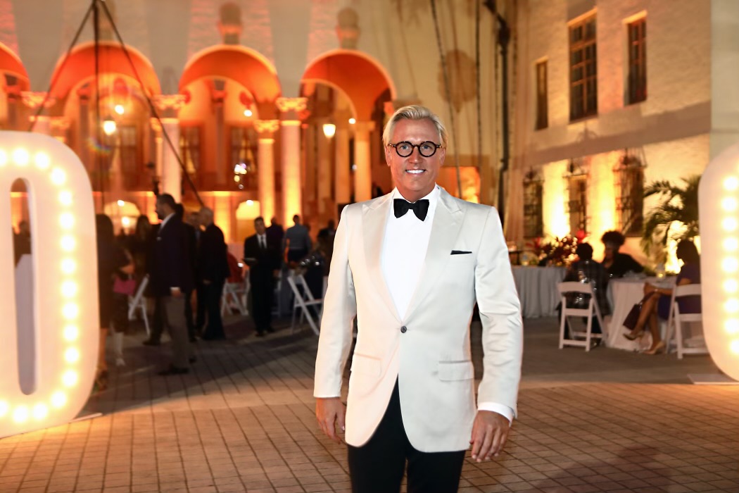 Tom Noel in a white dinner jacket at an evening event